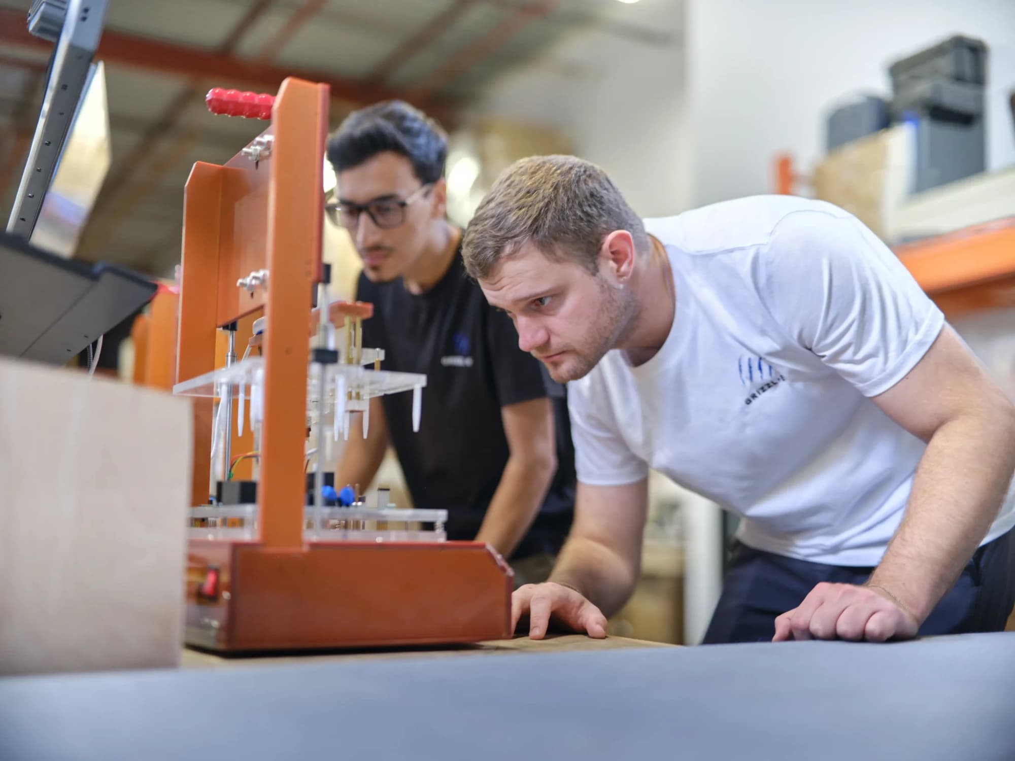 Technicians testing Grizzl-E components at the Markham facility